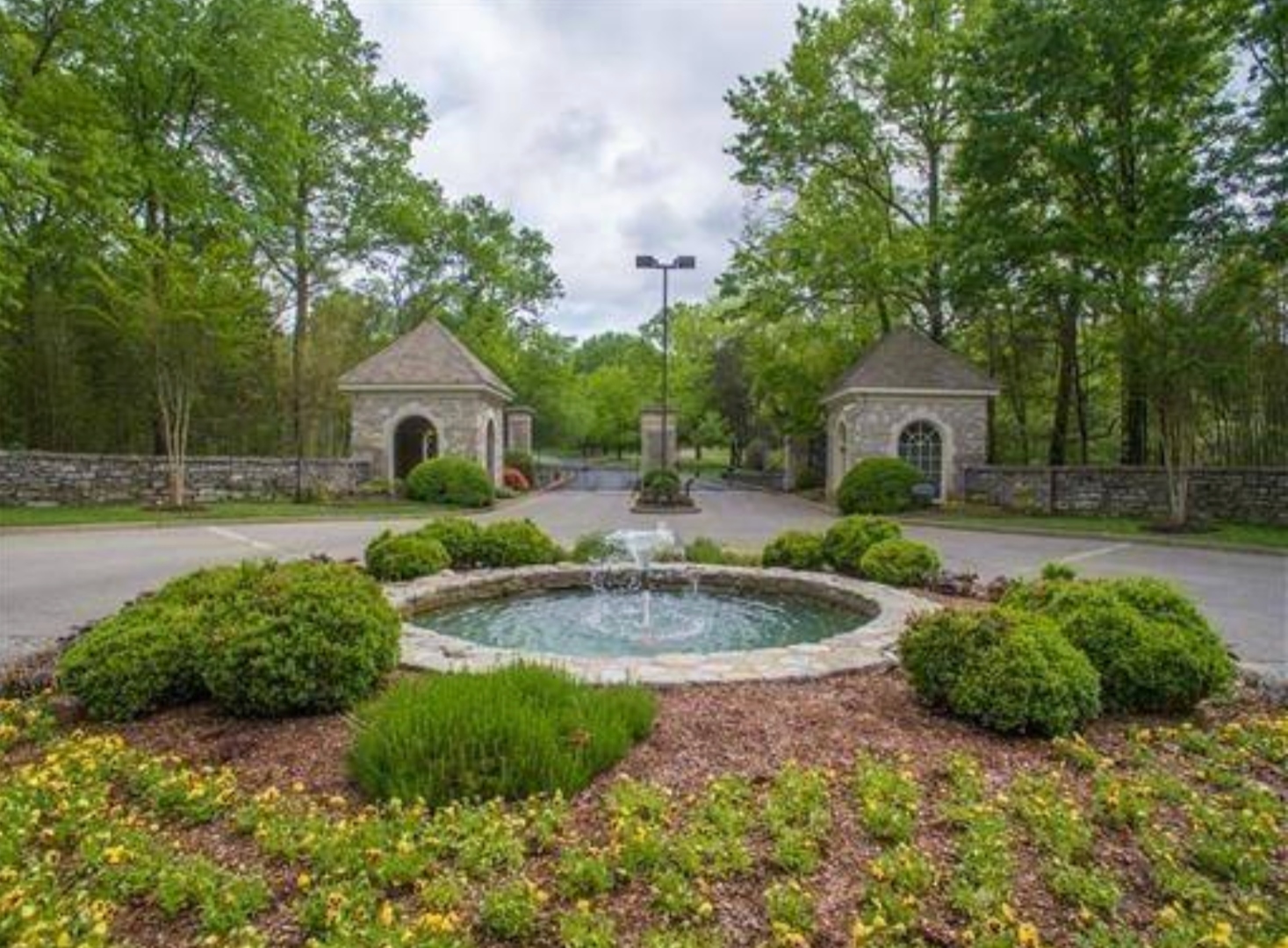 The stone fountain inside the Otter Wood entrance roundabout